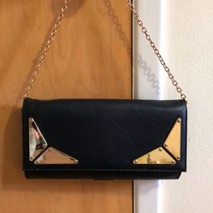 Black clutch with gold detail